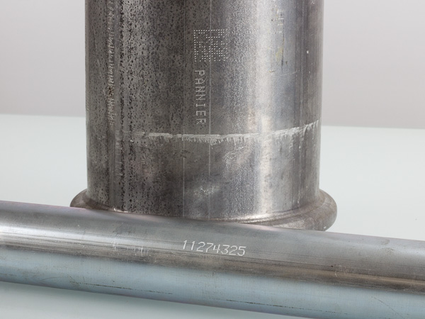 stamped text and 2D codes on metal pipes