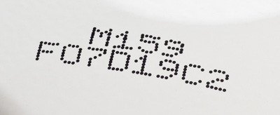 Continuous ink jet codes on plastic parts with black ink.