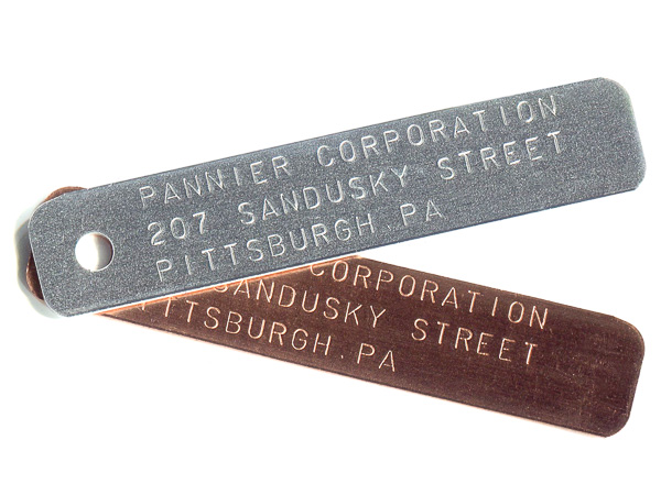 stamped aluminum and brass tags