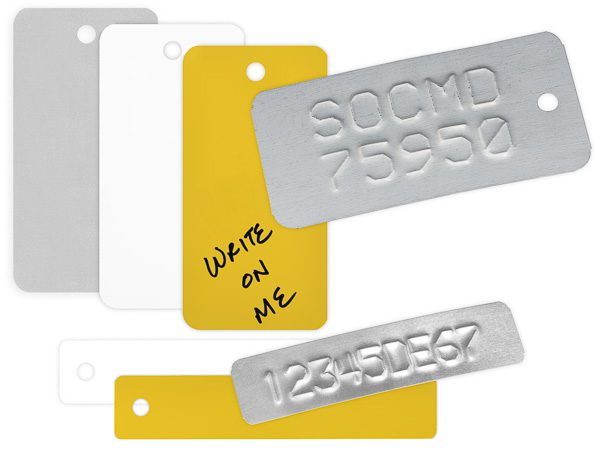 several 1" and 2" wide steel tags for embossing and writing on, galvanized finish and color coated white and yellow