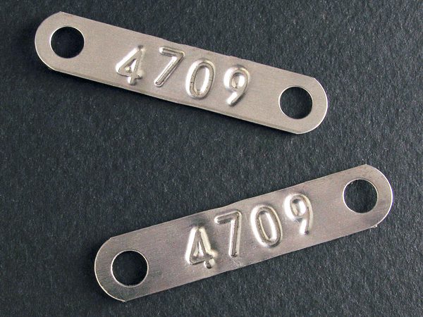 Debossed metal tags