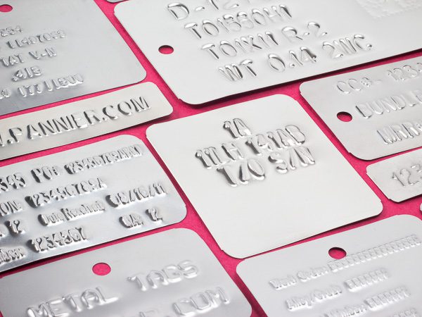 Embossed metal tags