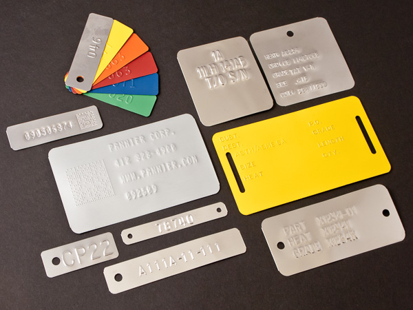 embossed metal tags, bare and colored